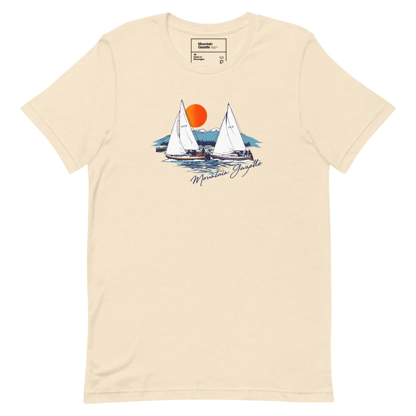 Beige t-shirt with sailboat graphic and 'Mountain Gazette' text on a white background
