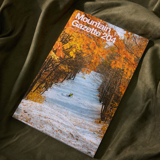 Magazine titled 'Mountain Gazette 204' on a textured surface