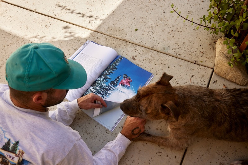 Man reading skiing article in Mountain Gazette issue 202 the fall issue