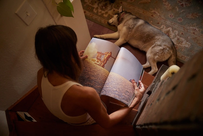 Woman reading Mountain Gazette magazine issue 202