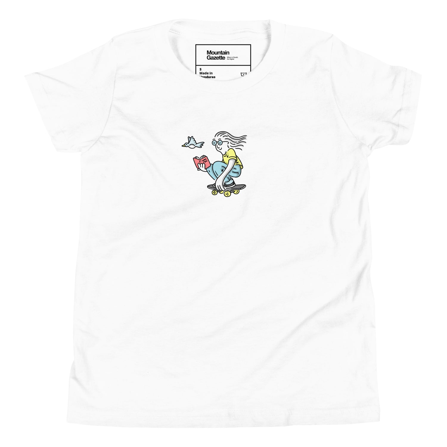 White t-shirt with a colorful graphic of a skateboarder reading a book, on a white background.