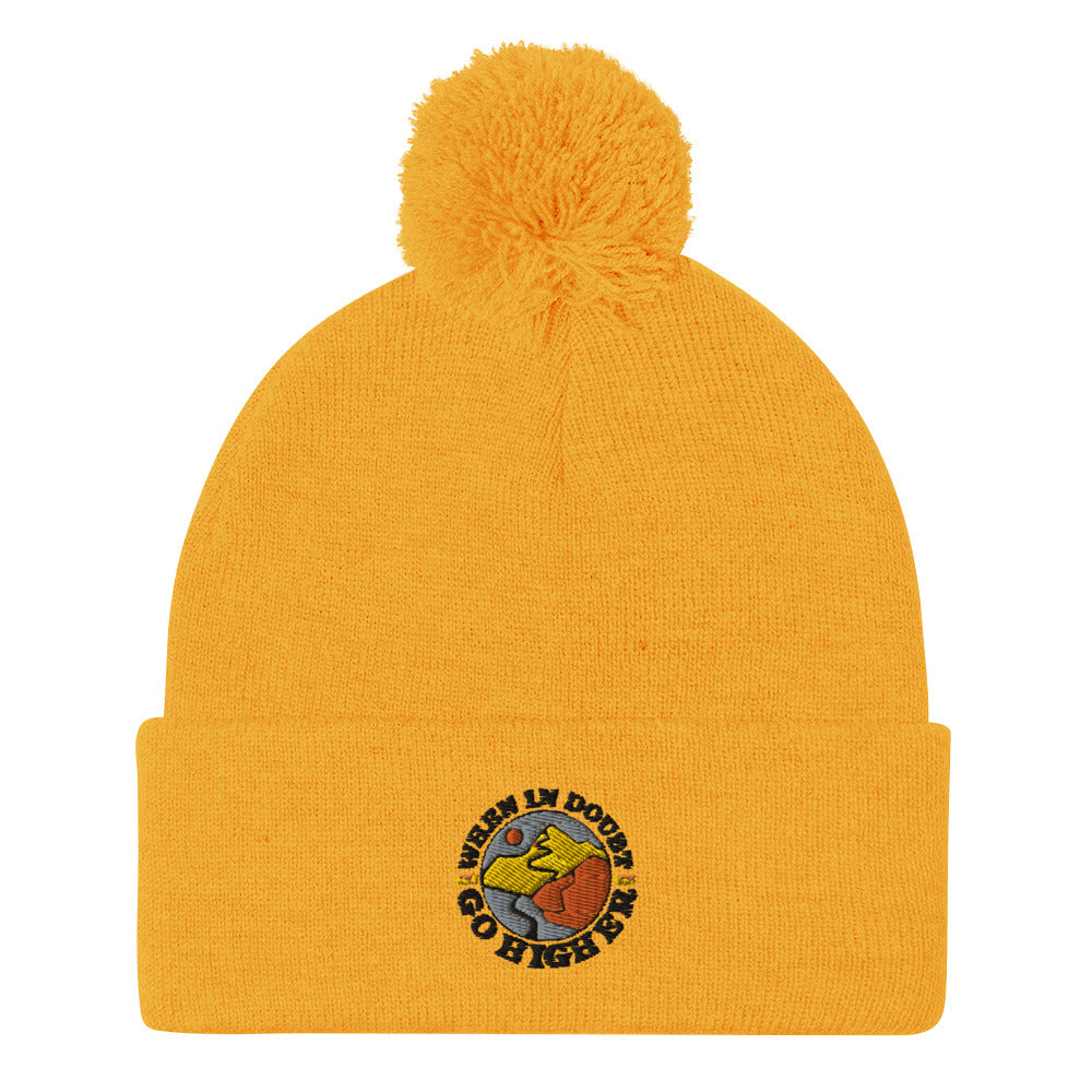 Warm and stylish pom-pom beanie with stitched mountain-themed logo