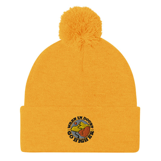 Warm and stylish pom-pom beanie with stitched mountain-themed logo